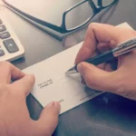 How to Cash a Two-Party Check With One Signature or Without the Other Person